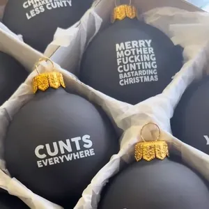 Set of matte black funny Christmas ornaments with golden caps for festive holiday decor