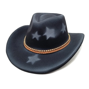 Detail of black wool felt cowboy hat featuring grey star patterns and a woven leather band