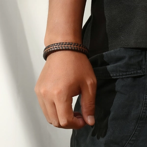 Retro woven leather bracelet for men featuring contrasting black and brown textures
