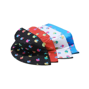 Collection of colorful mushroom print bucket hats in black, red, white, and blue colors