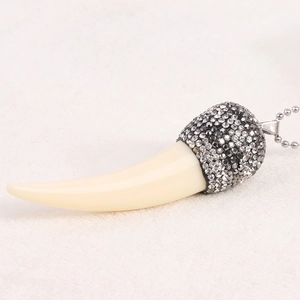 Retro 85mm ivory horn pendant necklace with sparkling dark rhinestones on a silver bead chain