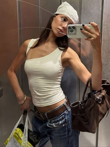 Slim fit white asymmetric one-shoulder tank top for women in a modern minimalist style