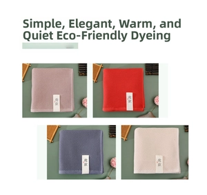 Macro detail of wabi-sabi style waffle weave cotton towels in four assorted colors