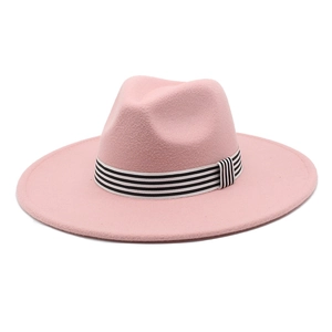 Detailed top view of pink wide brim fedora hat with black and white striped ribbon band