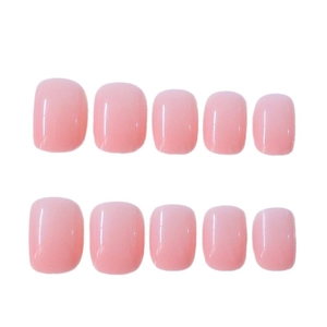 Set di 10 unghie finte corte rotonde rosa pallido traslucido con finitura lucida su bianco