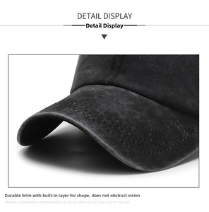 Detailed close-up of reinforced stitching on washed denim brim of vintage baseball cap