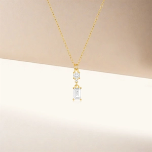 Detail of S925 silver necklace featuring tiered zircon pendant and golden chain link