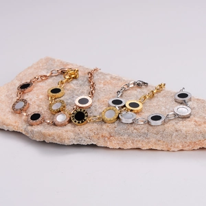 Minimalist Roman numeral bracelets in rose gold, gold, and silver with mother of pearl