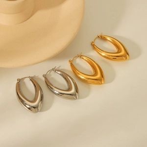 Thick oval chunky hoop earrings in gold and silver finish made of durable stainless steel