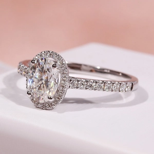 Macro shot of silver halo ring with large oval zircon and pavé setting stones