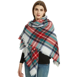 Classic British plaid cashmere-like scarf with fringe detail shown on a model