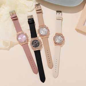 Close-up of four rhinestone studded leather strap quartz watches in various elegant colors