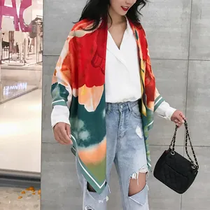 Detailed view of 130cm artistic oil painting floral scarf draped over a casual white shirt
