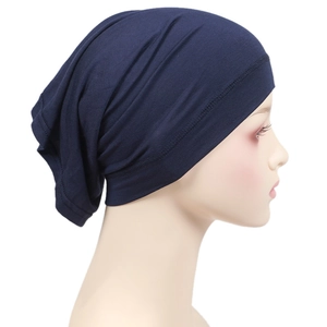 Detail view of a navy blue modal hijab cap displayed on a mannequin side profile