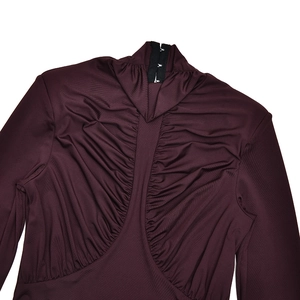 Detail view of burgundy ruched fabric with back zipper and high neck on a long sleeve dress