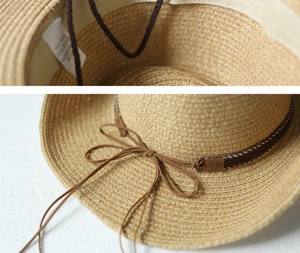 Detail showing the straw texture, interior sweatband, and decorative suede bow ribbon