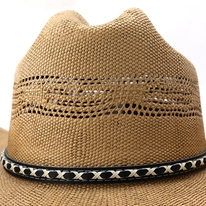 Close-up of brown straw fedora hat with breathable hollow weave and black stitched band