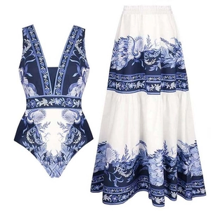 Blue and white floral porcelain print one-piece swimsuit with matching tiered maxi skirt set