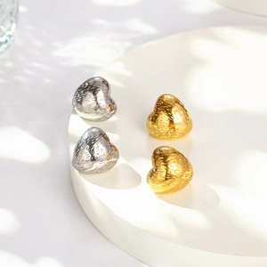 Minimalist C-shaped geometric heart earrings in gold and silver with hammer texture
