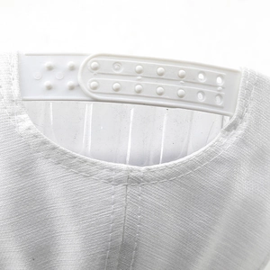 Detailed close-up of the white adjustable plastic snapback closure on a baseball cap