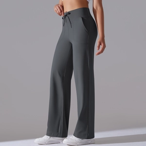 Detail of high waisted wide leg yoga pants in dark grey with drawstring and side pockets