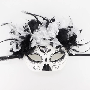 White skeleton masquerade mask with black flowers, delicate lace, and feathers for Day of the Dead