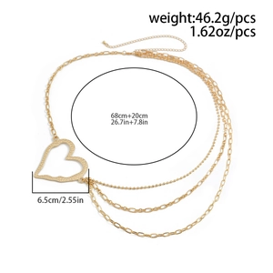 Detail of gold layered body chain featuring a large heart pendant with dimension specs