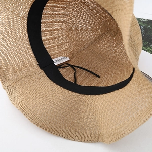 Close-up of sun hat interior showing black sweatband and adjustable drawstring