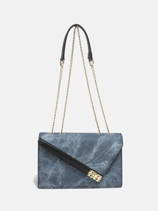 Denim blue crossbody bag with gold chain strap and black leather trim for women