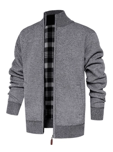 Detail of men's knitted zip jacket with gray marl texture and black-white checkered lining