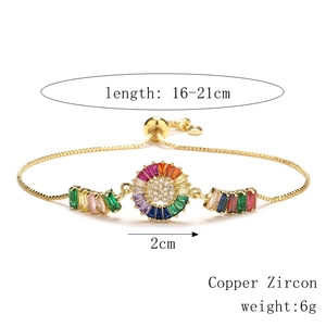 Detail of adjustable gold-plated chain with colorful zircon gems and sliding clasp closure