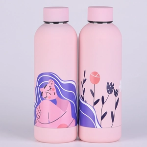 Close-up of pink stainless steel water bottles with minimalist line art floral patterns