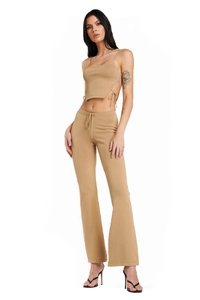 Detail of camel ribbed knit set with side-tie crop top and flared pants on a model