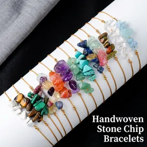 Handmade Bohemian woven bracelets with colorful natural gemstones on display stand