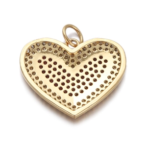 Macro shot of gold heart pendant with hollow back design and single hanging loop detail