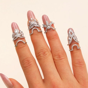 Silver nail rings set with sparkling zircons featuring four decorative crown shapes