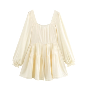 Detail of cream square neck mini dress with puffed sleeves and tiered ruffle skirt