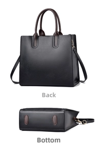 Detailed views of the minimalist black leather bag's back and reinforced oval bottom base