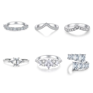 Detailed view of silver S925 sterling silver V-shaped rings and zircon stacking bands