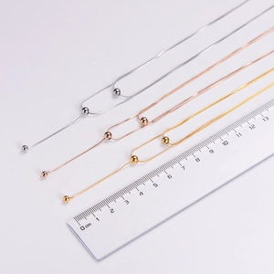 Detail of double-layer titanium steel necklaces with bead pendants and size reference