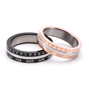 Rotatable stainless steel calendar ring with engraved months and dates in rose gold