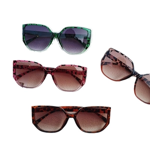 Oversized leopard print sunglasses with gradient lenses in green, pink, and brown colors