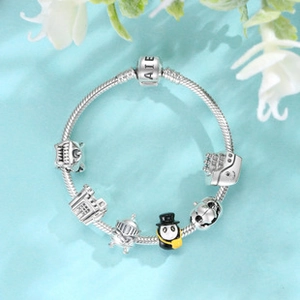 Detail of S925 sterling silver charm bracelet with panda castle and knight pendants