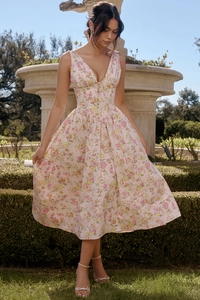 Detailed view of pink floral summer dress with deep V-neck and slim-fit waist design
