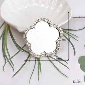 Close-up of 50mm silver flower vanity mirror charm with crystal rhinestones detail