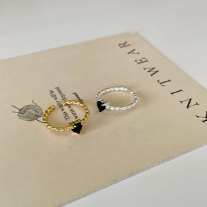Adjustable sterling silver braided ring featuring a black heart-shaped zircon stone