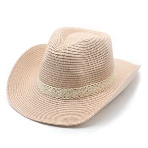 Close-up of woven straw cowboy hat featuring elegant white lace ribbon detailing