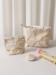 Set of two vintage linen cosmetic bags with fringe detail and metal zippers in cream white