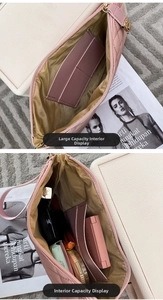 Pink quilted cosmetic bag interior showing large capacity and internal pockets