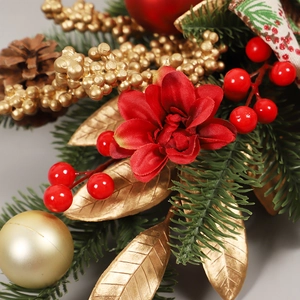 Christmas pine cone and red berry door swag with golden leaves and festive ribbons